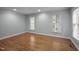 Room featuring natural light with two windows and hardwood floors at 102 Mel Oak Dr, Chapel Hill, NC 27516