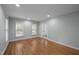 Bright room with natural light, hardwood floors, crown molding, and a glass-paned door at 102 Mel Oak Dr, Chapel Hill, NC 27516