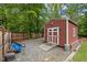 A well-kept shed with a ramp and storage space, surrounded by a gravel yard at 102 Mel Oak Dr, Chapel Hill, NC 27516