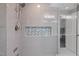 Modern shower with gray tiles and glass door at 102 Mel Oak Dr, Chapel Hill, NC 27516