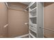 Walk-in closet with custom shelving and ample space for organizing clothes at 102 Mel Oak Dr, Chapel Hill, NC 27516