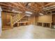 Unfinished attic area shows wooden construction, rafters, and a utility staircase at 103 Castill Pl, Garner, NC 27529