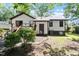 Backyard shows wooden deck, modest lawn area, mature plantings, and the exterior of the house at 103 Castill Pl, Garner, NC 27529