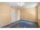 Bedroom with ceiling fan, window, and outdated carpet at 103 Castill Pl, Garner, NC 27529
