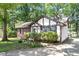 Charming exterior view of a home with brick and siding, complemented by mature trees and landscaping at 103 Castill Pl, Garner, NC 27529