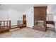 The living room features a brick fireplace and a landing with wood railing at 103 Castill Pl, Garner, NC 27529
