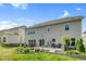 Spacious backyard featuring a stone patio, flower beds, and a well-maintained lawn perfect for outdoor living at 106 Elmsford St, Durham, NC 27703