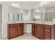 Bathroom featuring double vanities with ample storage, well-lit mirrors, and neutral finishes, designed for functionality and style at 106 Elmsford St, Durham, NC 27703