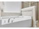 Close-up of a luxurious soaking tub with a tile surround, complemented by a glass-enclosed shower and a large window at 106 Elmsford St, Durham, NC 27703
