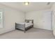 Bedroom features carpet floors, natural light, and a twin bed with neutral bedding at 106 Elmsford St, Durham, NC 27703
