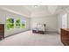 Spacious bedroom with large windows, neutral walls, and generous space, offering comfort and natural light at 106 Elmsford St, Durham, NC 27703