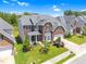 Beautiful two-story brick home featuring a manicured front yard and attached two-car garage at 106 Elmsford St, Durham, NC 27703