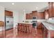 Spacious kitchen with granite counters, stainless appliances, and a center island at 106 Elmsford St, Durham, NC 27703