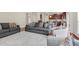 Bright living room featuring two sofas and a view into the kitchen and dining area at 106 Elmsford St, Durham, NC 27703