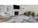 Spacious living room with fireplace, built-in shelving, and comfortable seating area at 106 Elmsford St, Durham, NC 27703