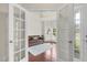 Bright living room with hardwood floors, french doors, and ample natural light at 106 Elmsford St, Durham, NC 27703