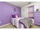 Charming bedroom with purple walls, a cozy bed, and coordinating purple furniture at 109 D A King Dr, Willow Springs, NC 27592