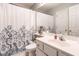 Well-lit bathroom features a shower curtain, vanity with sink, and ample storage at 1111 Parkridge Ln # 103, Raleigh, NC 27605