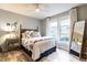 Cozy bedroom with a ceiling fan, large windows, and charming decor for a relaxing space at 1111 Parkridge Ln # 103, Raleigh, NC 27605