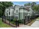 Charming multi-level condo features a fenced yard and tasteful, neutral siding at 1111 Parkridge Ln # 103, Raleigh, NC 27605