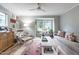 Bright living room featuring stylish furnishings, a ceiling fan and outdoor views at 1111 Parkridge Ln # 103, Raleigh, NC 27605