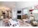 Sun-lit living room with fireplace, ceiling fan and adjacent work space at 1111 Parkridge Ln # 103, Raleigh, NC 27605