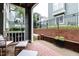 Charming patio with a brick wall and seating, perfect for relaxation and privacy at 1111 Parkridge Ln # 103, Raleigh, NC 27605