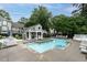 Community pool area with lounge chairs and shaded seating, perfect for relaxation and recreation at 1111 Parkridge Ln # 103, Raleigh, NC 27605