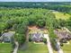 Gorgeous aerial view of the home nestled among lush trees and sprawling land at 113 Cedardale Ct, Clayton, NC 27520