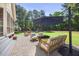 Outdoor patio features a seating area, umbrella, and a well-manicured lawn at 113 Cedardale Ct, Clayton, NC 27520