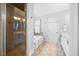 Bright bathroom features a soaking tub, glass enclosed shower and double sink vanity with marble countertop at 113 Cedardale Ct, Clayton, NC 27520
