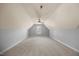Finished bonus room boasts carpeting, a ceiling fan, and natural light at 113 Cedardale Ct, Clayton, NC 27520
