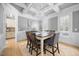 Charming dining room with tray ceiling, chandelier, and hardwood flooring perfect for entertaining at 113 Cedardale Ct, Clayton, NC 27520