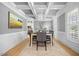 Elegant dining room featuring coffered ceilings, decorative lighting, and hardwood flooring at 113 Cedardale Ct, Clayton, NC 27520