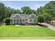 Beautifully landscaped home with a welcoming porch and well-manicured front yard at 113 Cedardale Ct, Clayton, NC 27520