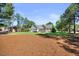 Charming home featuring a manicured lawn, landscaping, and a welcoming front porch at 113 Cedardale Ct, Clayton, NC 27520