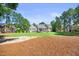Charming home featuring a manicured lawn, landscaping, and a welcoming front porch at 113 Cedardale Ct, Clayton, NC 27520