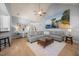 Bright living room with vaulted ceilings, ceiling fan, recessed lighting, and neutral colored walls and furniture at 113 Cedardale Ct, Clayton, NC 27520