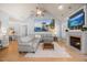 Cozy living room with a fireplace, TV, hardwood flooring, and plenty of natural light at 113 Cedardale Ct, Clayton, NC 27520