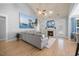 Bright living room with fireplace, TV, hardwood floors and ample seating for relaxation at 113 Cedardale Ct, Clayton, NC 27520