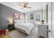 Relaxing bedroom showcases plush bedding, neutral colors, and a ceiling fan for year-round comfort at 113 Cedardale Ct, Clayton, NC 27520
