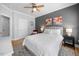 Relaxing bedroom showcases plush bedding, neutral colors, and a ceiling fan for year-round comfort at 113 Cedardale Ct, Clayton, NC 27520
