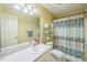 Standard bathroom featuring a vanity sink, toilet, and shower with a decorative shower curtain at 115 Redbay Ln, Clayton, NC 27527
