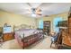Comfortable bedroom featuring a ceiling fan and natural light from the windows at 115 Redbay Ln, Clayton, NC 27527