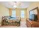 Comfortable bedroom with a queen bed, dresser, and light-colored walls at 115 Redbay Ln, Clayton, NC 27527