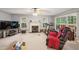 Spacious living room featuring a fireplace, and large windows for natural light at 115 Redbay Ln, Clayton, NC 27527