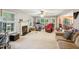 Cozy living room features a fireplace, neutral walls, and large windows with natural light at 115 Redbay Ln, Clayton, NC 27527