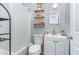 Compact bathroom features a shower-tub combo, toilet, and a vanity with sink at 118 Lynn Rd, Durham, NC 27703