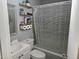 Well-maintained bathroom with a shower and storage shelves, offering functionality and style at 118 Lynn Rd, Durham, NC 27703