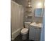 Compact bathroom with a shower and vanity, designed for efficiency and comfort at 118 Lynn Rd, Durham, NC 27703